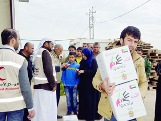 توزيع مساعدات إماراتية على الأسر العراقية النازحة